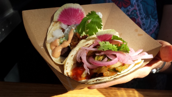 Brenda Anderson's  small slow-roasted warm tacos are made layers of slow-cooked bbq pork, black beans, sliced radish and cotja cheese, with a spicy crema that ties it all together.  Photo: Geneva Anderson  