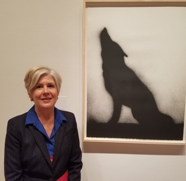 Karin Breuer, curator of “Ed Rusha and the Great American West” and curator in charge of the Achenbach Foundation for Graphic Arts, pictured with Ed Ruscha’s “Coyote,” a 1989 lithograph in the FAMSF collection. Photo: Geneva Anderson
